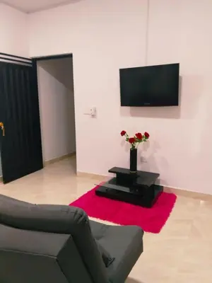 a living room with a couch and a red rug at Apartamento Capri 2 in Puerto Triunfo