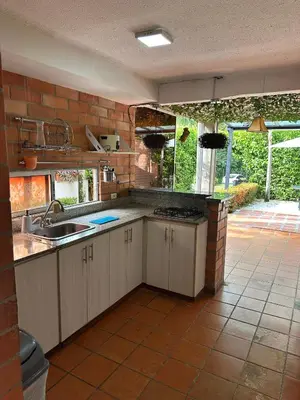 a kitchen with a sink and a counter top at Cabaña ciudadela del sol in San Jerónimo