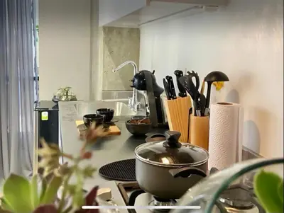 a kitchen counter with a pot on a stove at Loft con Patio privado in Medellín