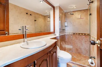a bathroom with a sink and a shower and a toilet at City views Air-conditioning Heated pool in Envigado