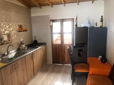a kitchen with a sink and a refrigerator at habitación amoblada en sonson antioquia colombia in Sonsón