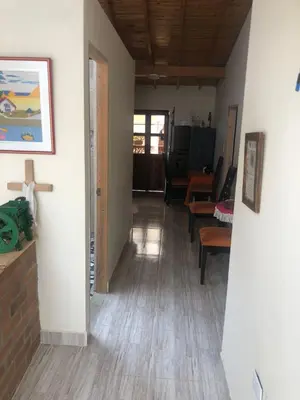 a hallway with a living room and a dining room at habitación amoblada en sonson antioquia colombia in Sonsón