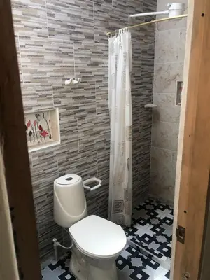 a bathroom with a toilet and a shower at habitación amoblada en sonson antioquia colombia in Sonsón