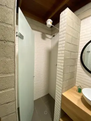 a bathroom with a sink and a mirror at Hospedaje San Diego in Medellín