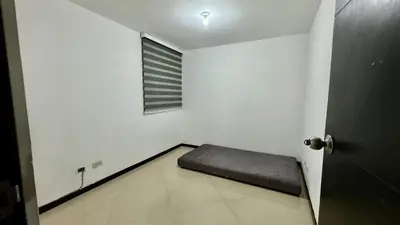 a room with a bed in a room with a window at Rodeo Alto in Belén