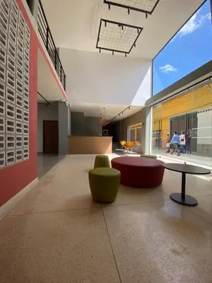 a room with a table and two chairs and a table at Hotel La Vega in Concepción