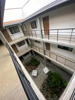 a view of a building with a balcony at Hotel La Vega in Concepción