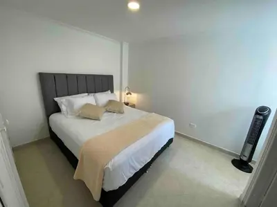 a bedroom with a large bed in a room at laureles excelente ubicacion la 70 estadio, cerca al poblado in Medellín