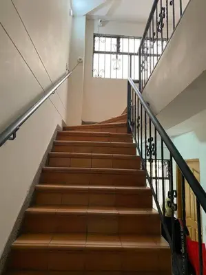a staircase in a building with a stair case at laureles excelente ubicacion la 70 estadio, cerca al poblado in Medellín