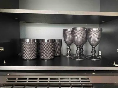 a row of wine glasses sitting on top of a stove at laureles excelente ubicacion la 70 estadio, cerca al poblado in Medellín