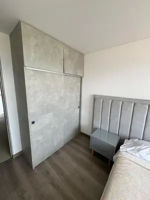 a bedroom with a bed and a large closet at Modern 3 Bedroom Apartment with balcony in Medellín