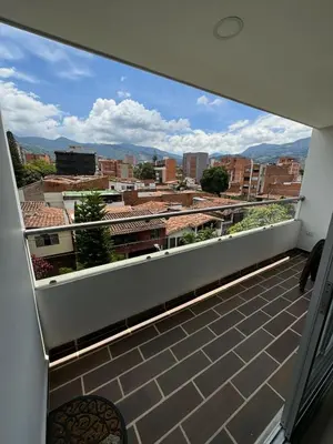 a balcony with a view of a city at Modern 3 Bedroom Apartment with balcony in Medellín
