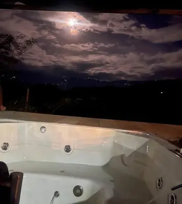 a bath tub with the moon in the sky at Finca en sopetrán in Sopetran