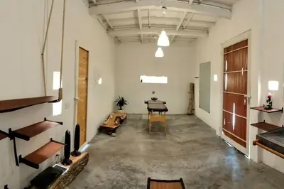 an empty room with a table and a chair at TerraMonte in Honda