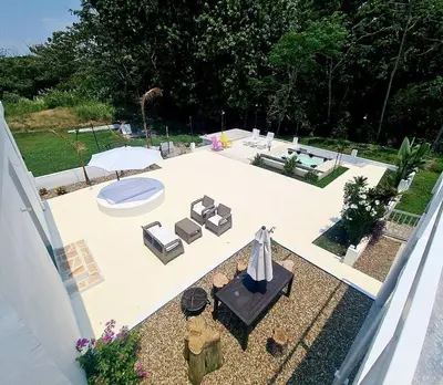 an overhead view of a patio with chairs and a umbrella at TerraMonte in Honda