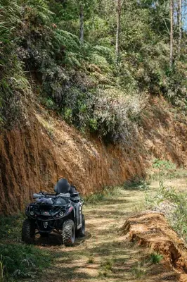 a quad bike parked on a dirt road at Refugio Natural - Cabañas Ecológicas con Jacuzzi, Guarne in Guarne
