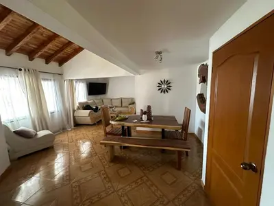 a living room with a table and a couch at Apartamento Edicio Torreón en Rionegro in Rionegro