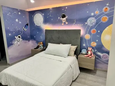 a bedroom with a bed with planets and stars at Luxury Home Medellin in El Poblado