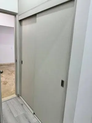 a sliding door in a room with a doorway at Luxury Home Medellin in El Poblado