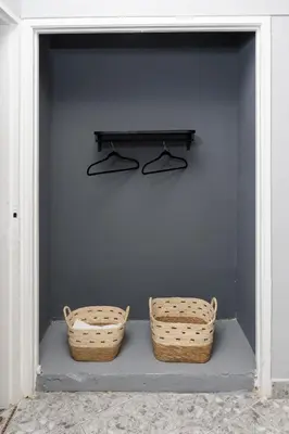 two baskets sitting on a shelf next to a wall at Hotel Hola Medellín in Medellín
