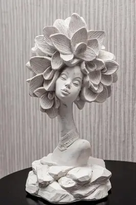 a statue of a woman with flowers on her head at Hotel Hola Medellín in Medellín