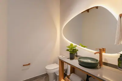 a bathroom with a sink and a mirror at Casa Serena Provenza in Medellín