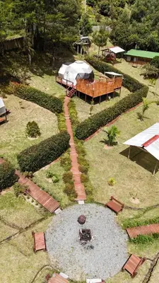 an aerial view of a garden with a pond at Boreal Refugio Natural in Sonsón