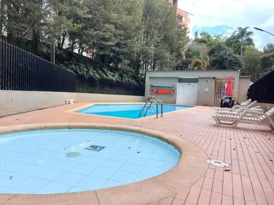 a large swimming pool in a brick yard with at Envigado Sereno in Envigado