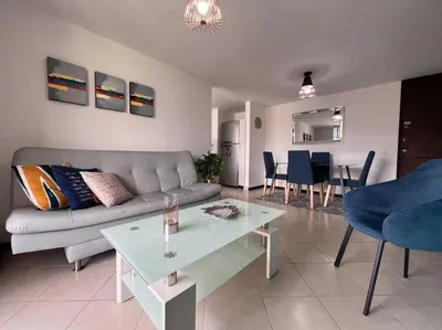 a living room with a couch and a table at Envigado Sereno in Envigado