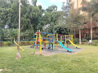 a playground with a colorful slide in a park at Envigado Sereno in Envigado