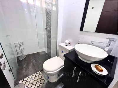 a white bathroom with a toilet and a sink at Luxury Studio in El Poblado Modern Charm in Envigado