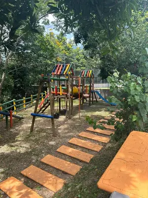 a park with a playground with a swing set at Hermosa Cabaña Familiar in San Jerónimo