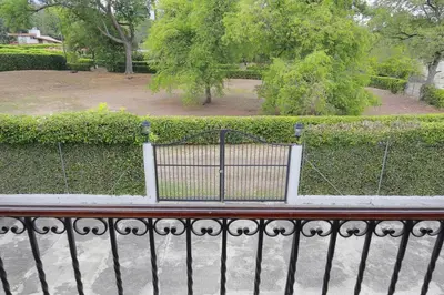 a iron fence with a park in the background at Acogedora Casa-Finca en Sopetran, Antioquia in Corral Falso