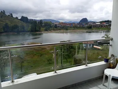 a view of a river from a balcony at Vista de lujo en Guatapé in Guatapé