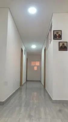 an empty hallway with white walls and tile floors at Vista de lujo en Guatapé in Guatapé