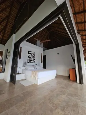 a bedroom with a white bed in a room at Villa en La Pintada con Piscina in La Pintada