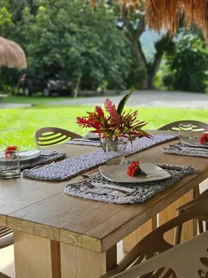 a wooden table with a plate of food on it at Villa en La Pintada con Piscina in La Pintada