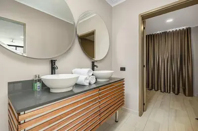 a bathroom with a sink and a mirror at white house poblado in El Poblado