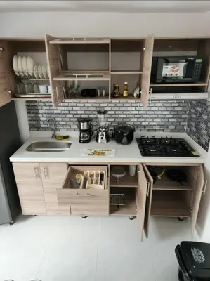 a small kitchen with a sink and a stove at GIGANTE y ELEGANTE APARTAMENTO UNIFAMILIAR in Belén