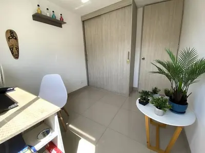 a kitchen with a table with plants on it at Central Family Home with Air Conditioning in Sabaneta