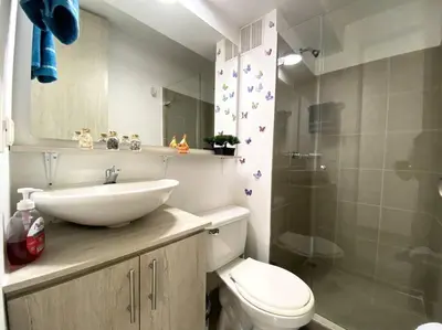 a bathroom with a sink and a toilet and a shower at Central Family Home with Air Conditioning in Sabaneta