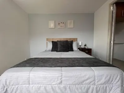a large white bed in a white bedroom at Serenity in Poblado in El Poblado
