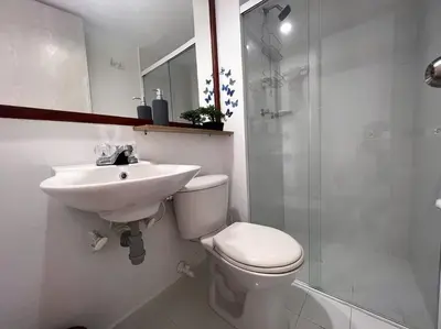 a bathroom with a sink and a toilet and a shower at Serenity in Poblado in El Poblado