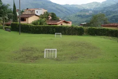 a white goal in the middle of a grass field at Casa Familiar y Naturaleza en Parcelación Privada in Amagá