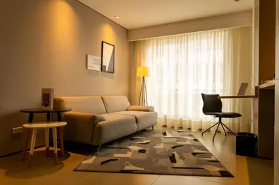 a living room with a couch and a chair at Quo Quality Hotel in Manizales