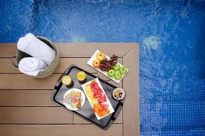 a tray of food with fruit on a table at Quo Quality Hotel in Manizales