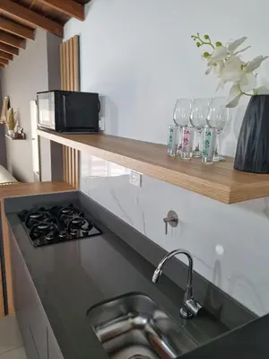 a kitchen counter with a sink and a stove at 302 Apartamento Completo en Medellín in Medellín