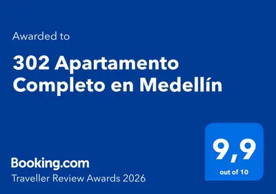 a blue sign that at 302 Apartamento Completo en Medellín in Medellín