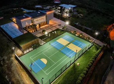 an aerial view of a tennis court at night at Luxurious Farm House in Rionegro