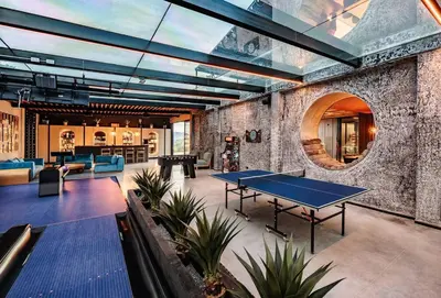 a room with a ping pong table in it at Luxurious Farm House in Rionegro